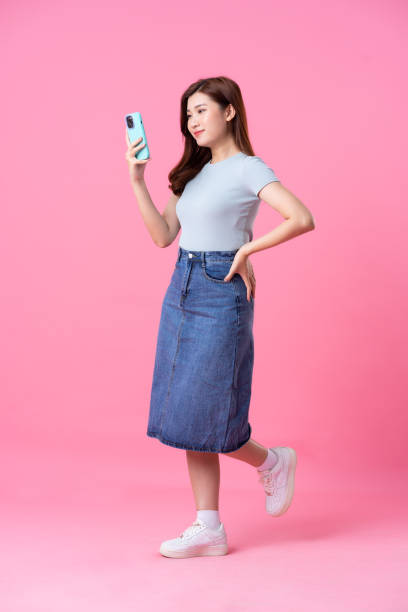 istock image of asian girl posing on pink background 1487721067