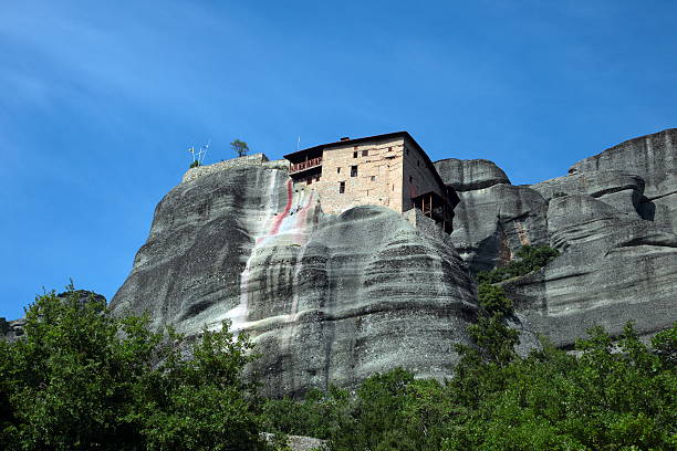 meteora - looking through window individuality old architecture foto e immagini stock