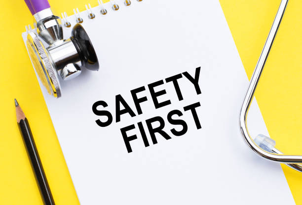 Free Stock Photo of Safety First spelled out with tiles on a yellow ...