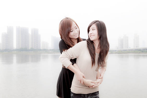 two girls having fun in the park,