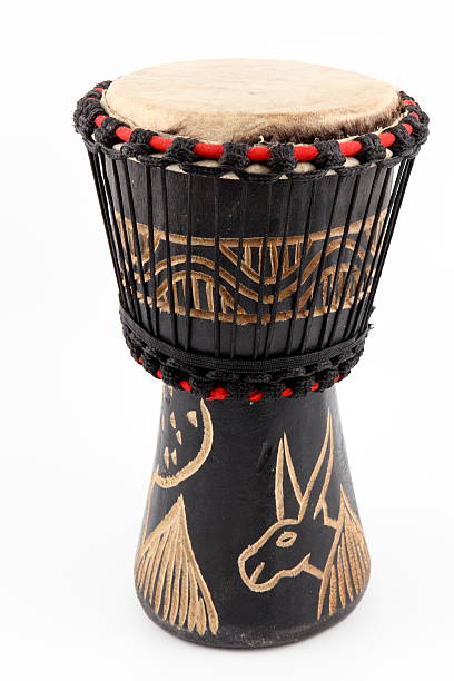 An isolated image of an African djembe drum African Djembe Drum on white background african musical instrument stock pictures, royalty-free photos & images