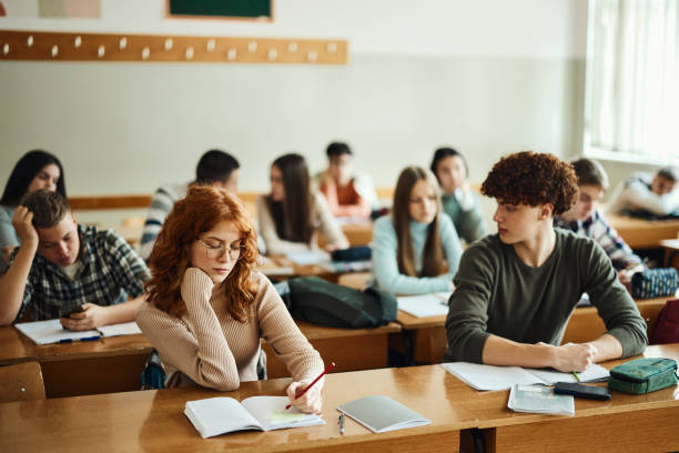 istock Large group of students on a a class at high school. 1487737831