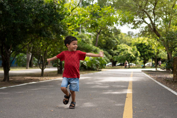 Smiling child running in public park