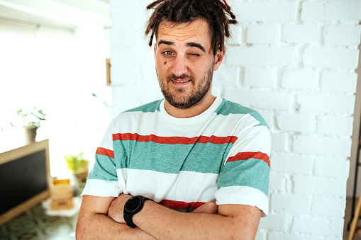 Portrait of a handsome young man posing indoors.