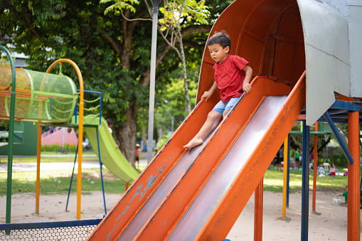 Child using public park toys