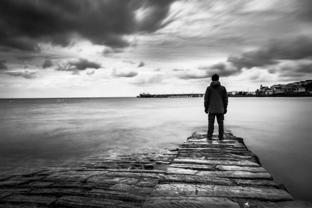 Lost man lonely man loosing the way on a foggy day. worried man standing stock pictures, royalty-free photos & images