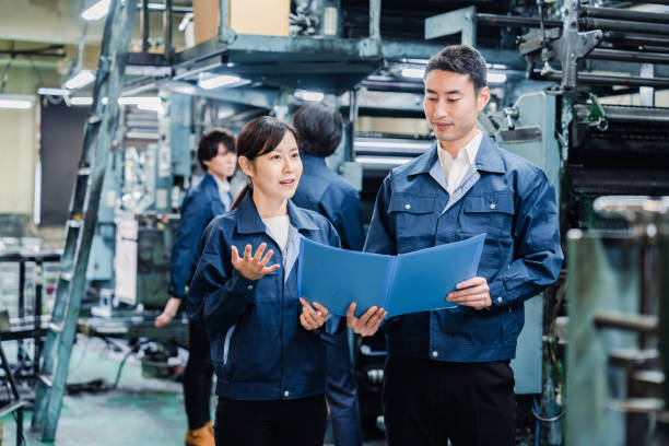 istock Workers checking production plans at the factory 1487739957