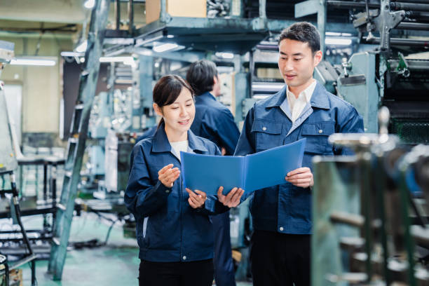 istock Workers checking production plans at the factory 1487739959