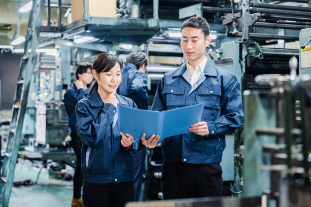istock Workers checking production plans at the factory 1487739966