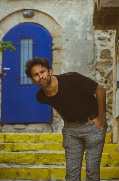 istock Latino looking weirdly at the camera 1487754696