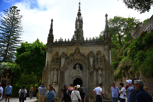Sintra, Portugal - May 5 : People are seen walking around the historical Quinta da Regaleira Palace in Sintra. It is classified as a World Heritage Site by UNESCO within the Cultural Landscape of Sintra. The number of foreign tourists visiting Portugal surpassed 2.8 million from January through March, making it the best first quarter on record despite high global inflation and interest rates, data from the National Statistics Institute (INE) showed on Friday.