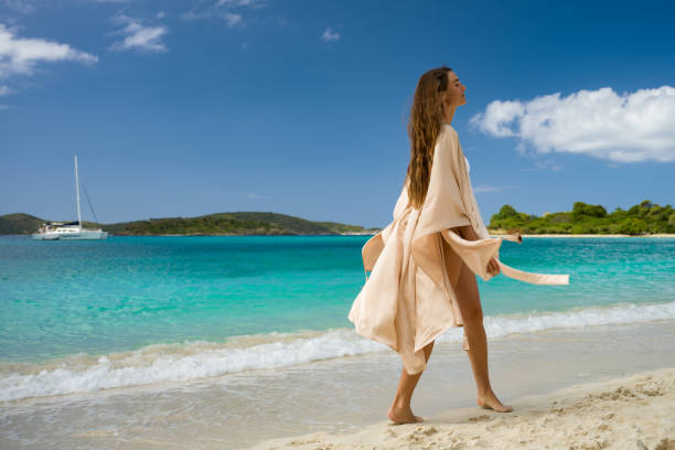 istock Woman with beach cover up 1487758202