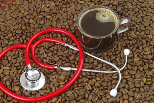 istock Cup of coffee with stethoscope on coffee beans. 1487761154