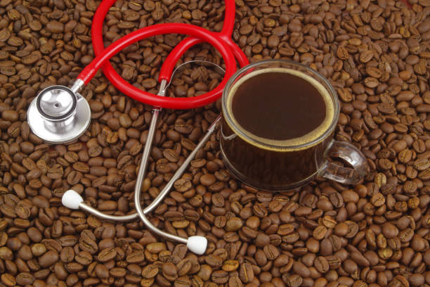 istock Cup of coffee with stethoscope on coffee beans. 1487761692