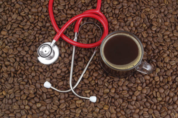 istock Cup of coffee with stethoscope on coffee beans. 1487762257