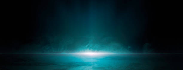 istock Empty dark blue abstract cement wall and studio room with smoke floating up the interior texture for display products wall background, empty dark scene, neon light, spotlights, and laser light 1487763100