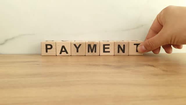 Payment word from wooden blocks