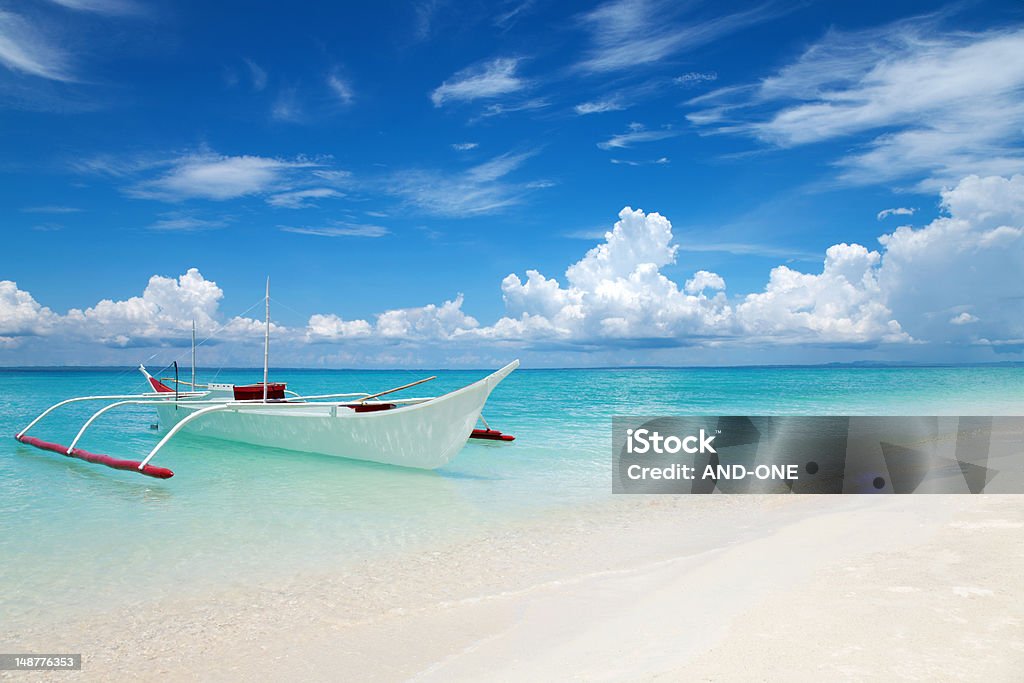 White boat on a tropical beach White boat on tropical Bantayan island in Philippines Cebu Province Stock Photo