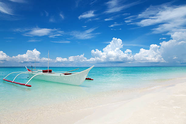 White boat on a tropical beach White boat on tropical Bantayan island in Philippines cebu province stock pictures, royalty-free photos & images