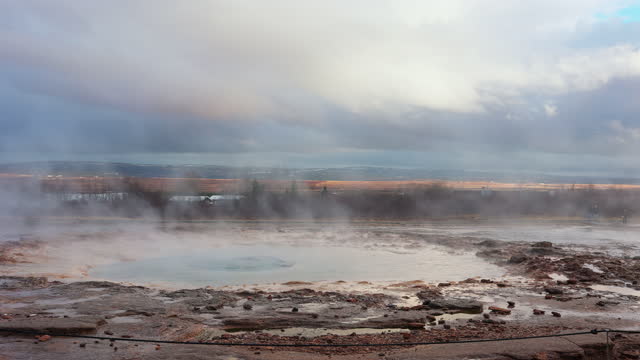 Icelandic geyser in panoramic scenery