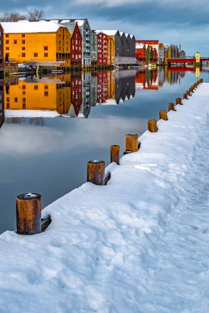 Trondheim, Norway. Winter in the old town district and the Nidelva river with colourful timber houses.