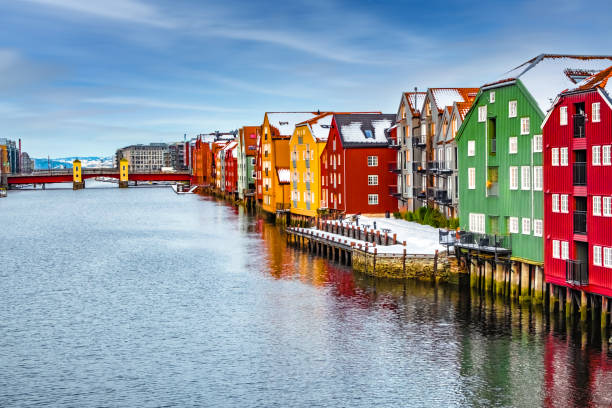 Trondheim, Norway. Winter in the old town district and the Nidelva river with colourful timber houses.