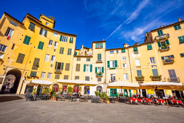 istock Lucca, Tuscany, Italy: the ancient elliptical Amphitheater square (Piazza dell'anfiteatro) 1487773240