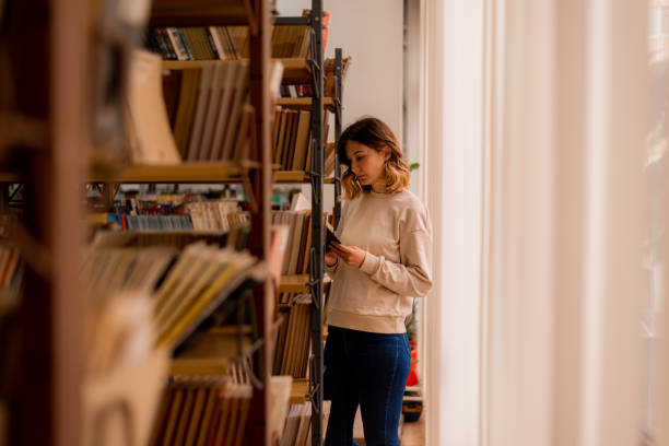 istock Standing besdies bookshelves 1487776897