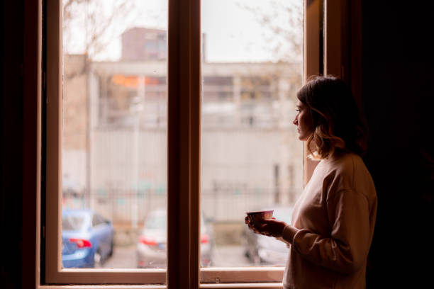 istock Girl with a coffee cup 1487776912