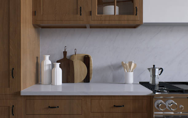 istock Spacious wooden kitchen with white marble. 3d rendering. A clean kitchen surface, appliances and kitchen utensils in the background. 1487779071