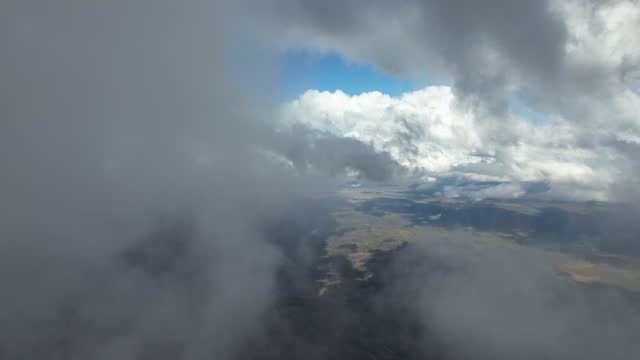 Aerial shot and movement between the clouds