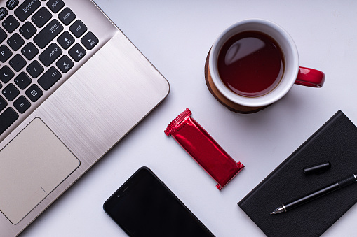 Flat lay photography product on the table with coffee break concept with wireless device