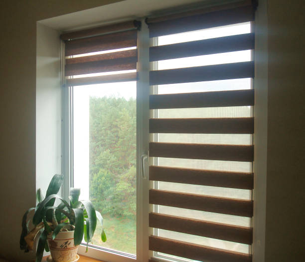 istock Double roller blinds closeup on the window in the interior 1487780545