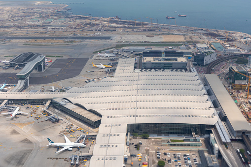 Hong Kong - April 17, 2023 : Hong Kong International Airport with the new SkyBridge connecting Terminal 1 with T1 Satellite Concourse in Chek Lap Kok, Hong Kong.