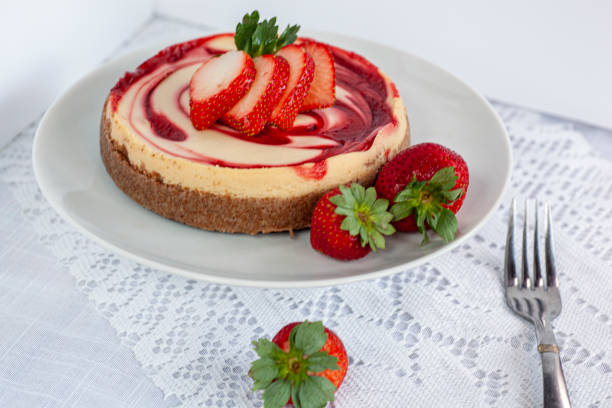 STRAWBERRY CHEESECAKE TOPPED WITH FRESH STRAWBERRIES