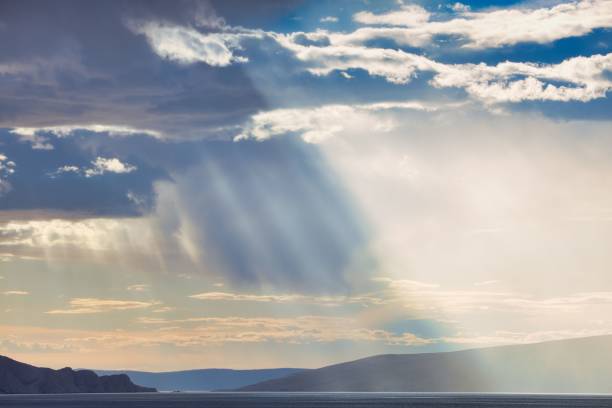 istock Beautiful seascape view with mountains against a cloudy sky 1487786191