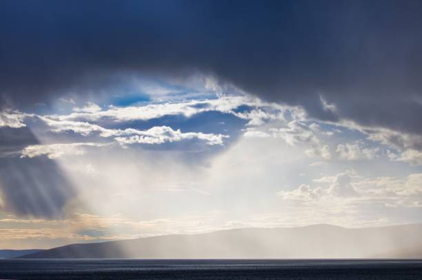 istock Beautiful seascape view with mountains against a cloudy sky 1487786193