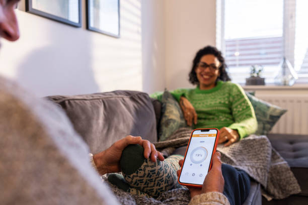 istock Central Heating Thermostat On The Mobile App 1487786537