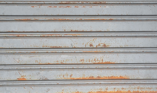 Aluminum corrugated garage door with rust