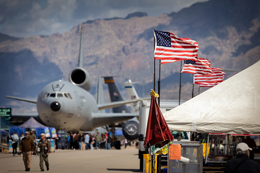 Tucson, Arizona, USA - March 24, 2023: American flags blow in the wind at the 2023 Thunder and Lightning Over Arizona airshow.