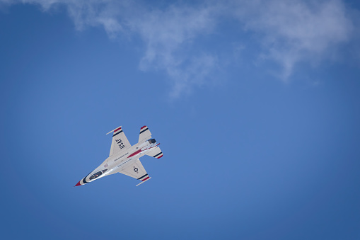 Tucson, Arizona, USA - March 24, 2023: A US Air Force Thunderbird perform at the 2023 Thunder and Lightning Over Arizona airshow..