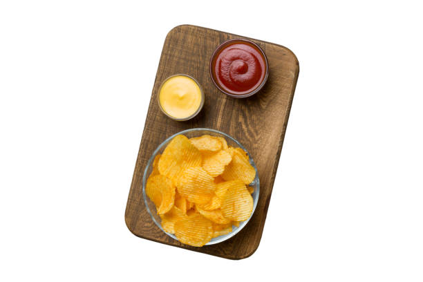istock Top view chips with sause in bowl isolated on white background, top view with copy space 1487797863