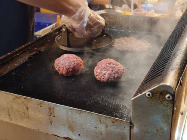 istock Beef burgers on the hot stove 1487801045
