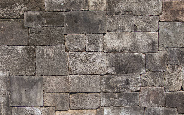 istock Ancient stone wall background and texture. These stone blocks were used to build temples in the Java region of Indonesia. 1487806829