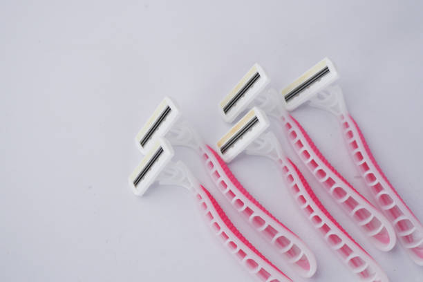 close up of pink color razor on table