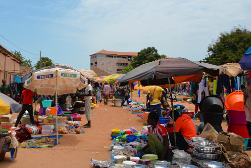 Cacheu, Guinea-Bissau: pots and pans and everything else, lively and colorful street street market.