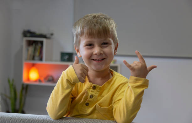 Teacher and students, Learn and study in a classroom of school where youngsters sit and listen attentively.