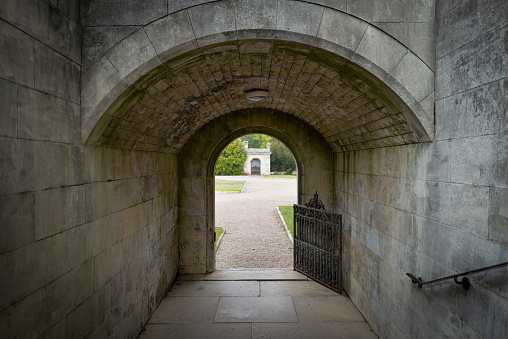 In August 2015, tourists were walking on the alley leading to the Villiers-Le-Mahieu castle to do a visit of the site, France.