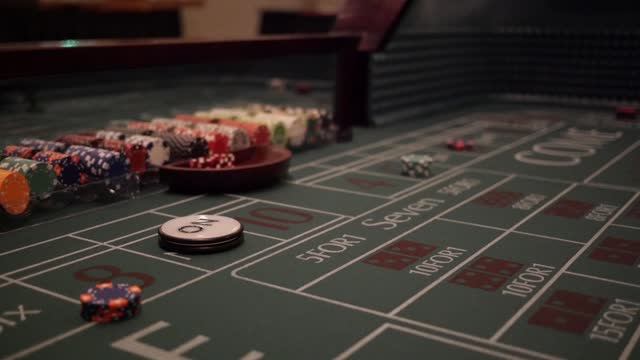 Dice being tossed on a craps table