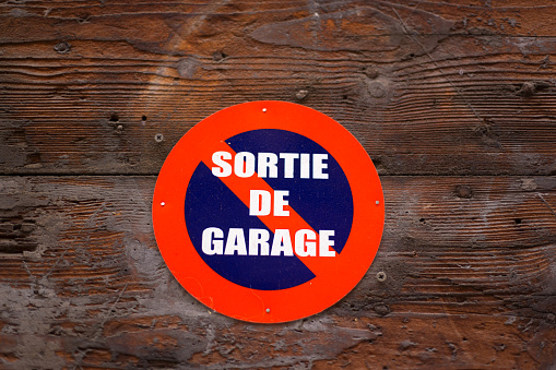 Lyon, France: Old Wood Door Sign: SORTIE DE GARAGE